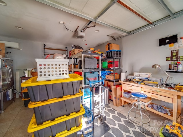 907 Edgewood Cir, Gastonia, NC 28052 - garage with freestanding refrigerator, a garage door opener, and a wall mounted air conditioner