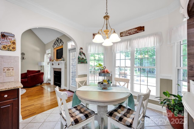 3610 Providence Mill Rd, Maiden, NC 28650 - dining area featuring a chandelier, light tile patterned floors, plenty of natural light, crown molding, and lofted ceiling