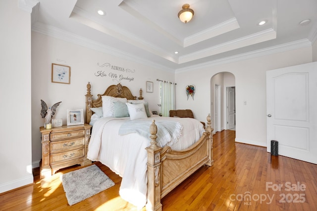 3610 Providence Mill Rd, Maiden, NC 28650 - bedroom with arched walkways, hardwood / wood-style flooring, a tray ceiling, crown molding, and baseboards