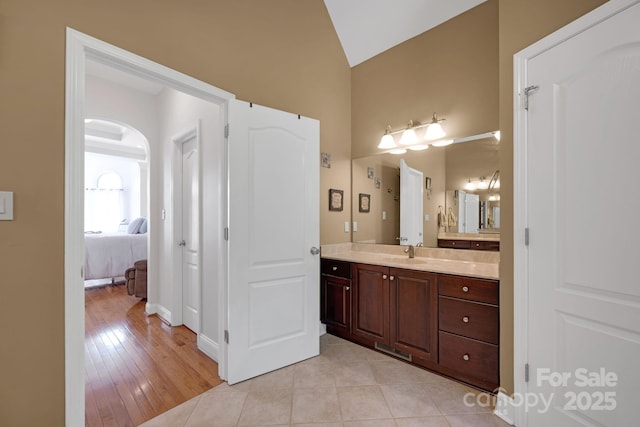 3610 Providence Mill Rd, Maiden, NC 28650 - ensuite bathroom with lofted ceiling, vanity, baseboards, and tile patterned floors