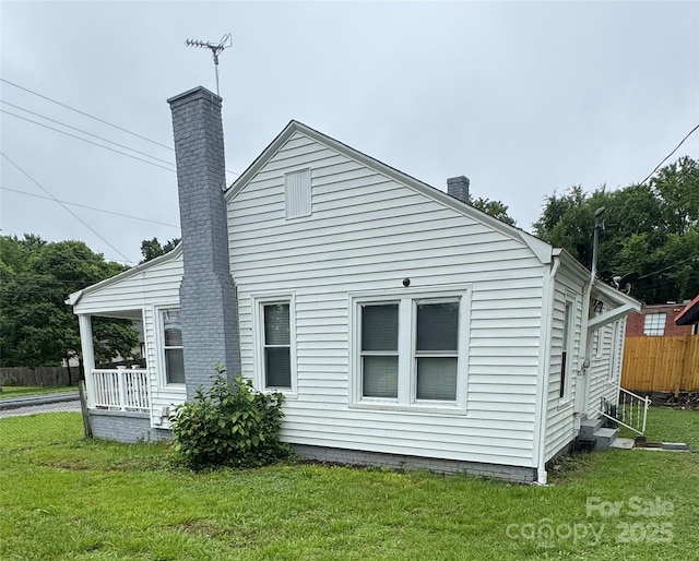 247 E Cabarrus Ave, Concord, NC 28025 - back of property with a chimney and entry steps