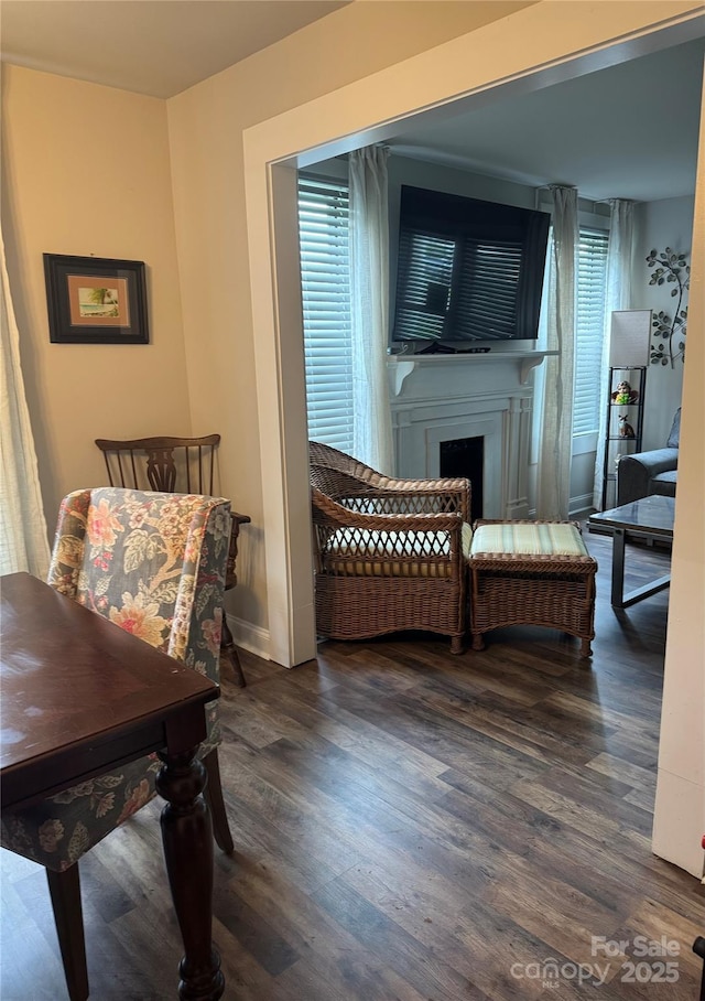 247 E Cabarrus Ave, Concord, NC 28025 - bedroom featuring wood finished floors and a fireplace