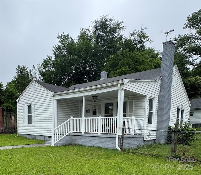 247 E Cabarrus Ave, Concord, NC 28025 - view of front of property with a chimney and a porch
