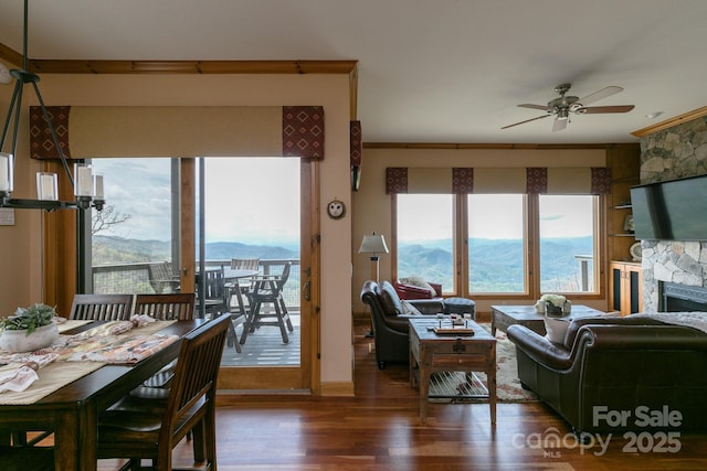 140 Slickrock Rd Unit F3, Burnsville, NC 28714 - living area featuring a ceiling fan, ornamental molding, a fireplace, and wood finished floors