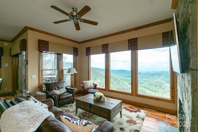 140 Slickrock Rd Unit F3, Burnsville, NC 28714 - living room featuring a ceiling fan, crown molding, and wood finished floors