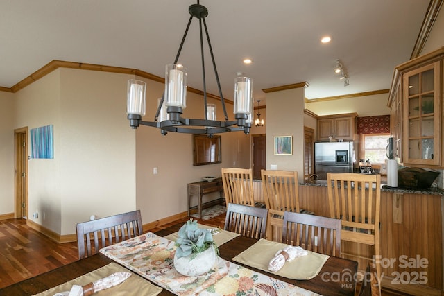 140 Slickrock Rd Unit F3, Burnsville, NC 28714 - dining area with crown molding, wood finished floors, baseboards, and a notable chandelier