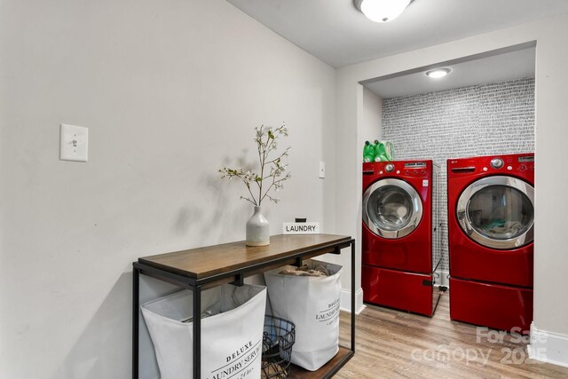 2212 Acme Rd, Belmont, NC 28012 - laundry area with washer and dryer, wood finished floors, and baseboards
