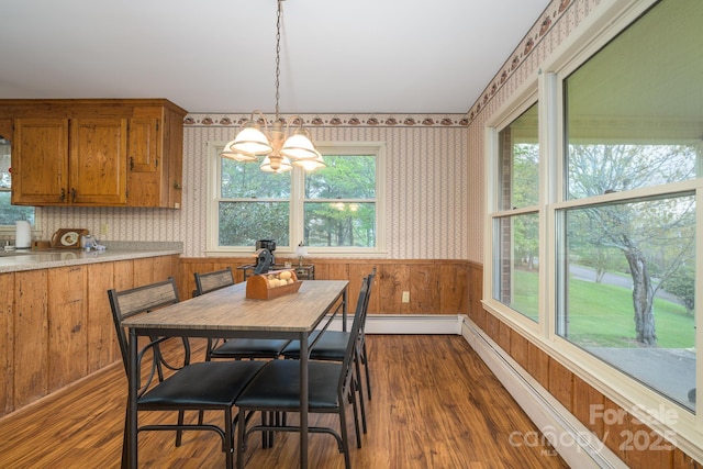 184 Buff Ridge Rd, Boone, NC 28607 - dining space featuring wallpapered walls, a chandelier, dark wood finished floors, a baseboard heating unit, and baseboard heating