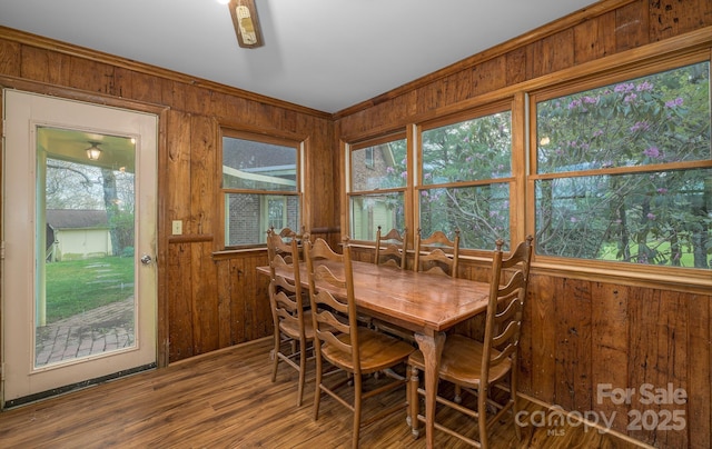 184 Buff Ridge Rd, Boone, NC 28607 - dining area featuring wood walls, wood finished floors, and ornamental molding