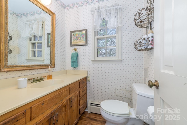 184 Buff Ridge Rd, Boone, NC 28607 - half bath featuring baseboard heating, toilet, wallpapered walls, and vanity