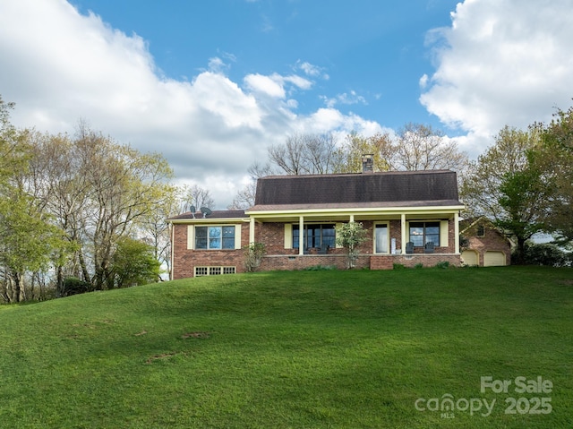 184 Buff Ridge Rd, Boone, NC 28607 - view of front of property featuring brick siding, a front yard, covered porch, a chimney, and a shingled roof