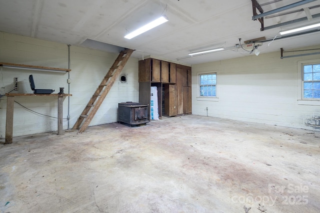 184 Buff Ridge Rd, Boone, NC 28607 - garage with a wood stove and concrete block wall
