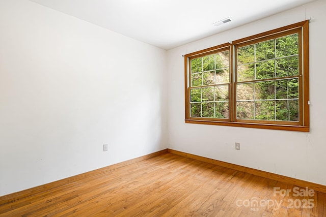 83 Snowy Cove Ln, Black Mountain, NC 28711 - empty room featuring light wood finished floors, healthy amount of natural light, and baseboards