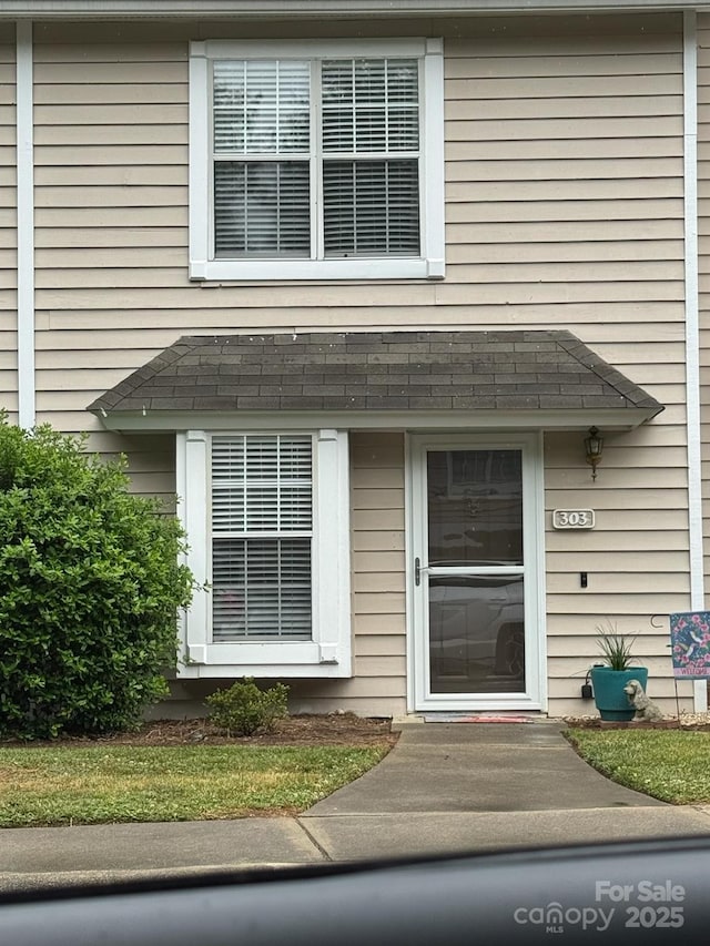 303 Heritage Pkwy, Fort Mill, SC 29715 - view of exterior entry featuring a shingled roof