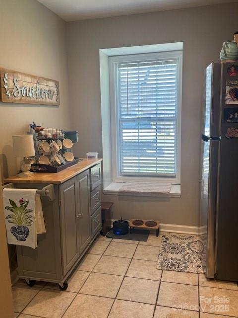 303 Heritage Pkwy, Fort Mill, SC 29715 - entryway with light tile patterned floors and baseboards