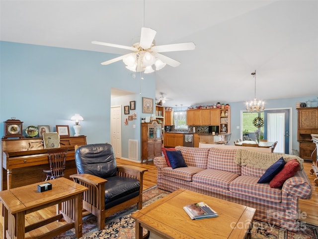 17 Gun Flint Dr, Burnsville, NC 28714 - living area with a chandelier, light wood-style flooring, a ceiling fan, and lofted ceiling