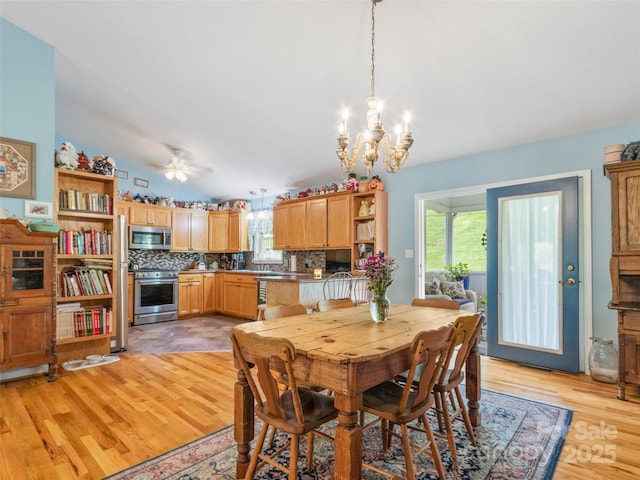 17 Gun Flint Dr, Burnsville, NC 28714 - dining space featuring healthy amount of natural light, a chandelier, light wood-style flooring, and ceiling fan