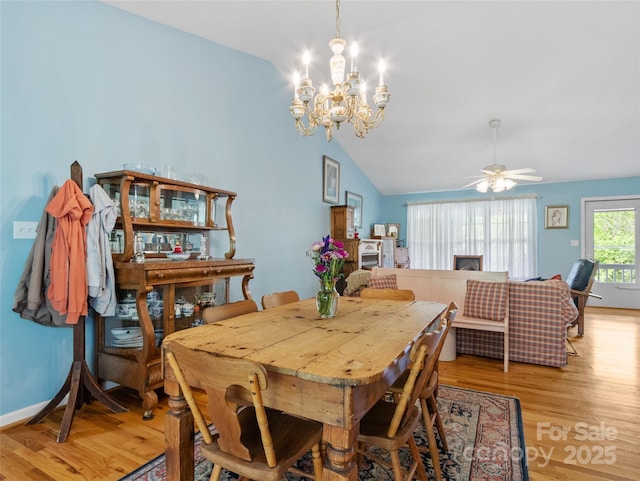 17 Gun Flint Dr, Burnsville, NC 28714 - dining space featuring vaulted ceiling, a chandelier, light wood-type flooring, and a ceiling fan
