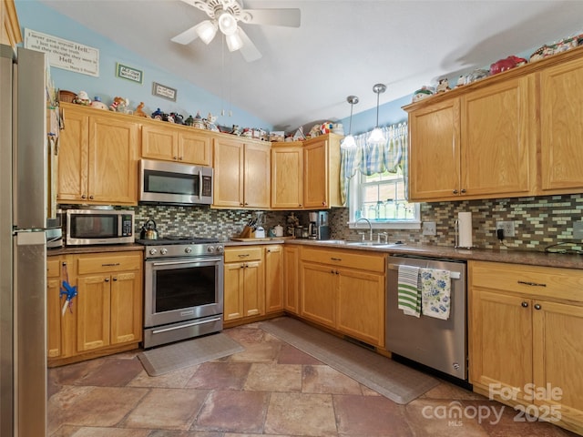 17 Gun Flint Dr, Burnsville, NC 28714 - kitchen featuring appliances with stainless steel finishes, lofted ceiling, ceiling fan, light stone finish floors, and a sink