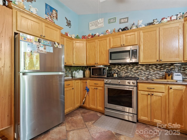 17 Gun Flint Dr, Burnsville, NC 28714 - kitchen with appliances with stainless steel finishes, decorative backsplash, and light stone finish floors