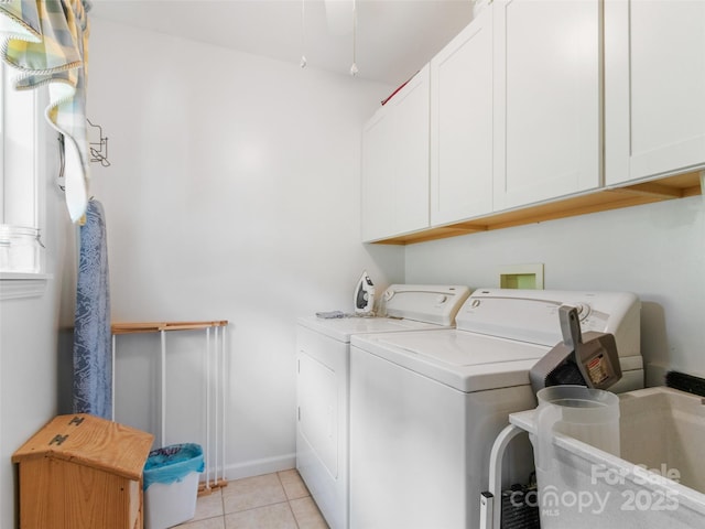 17 Gun Flint Dr, Burnsville, NC 28714 - laundry room with cabinet space, independent washer and dryer, light tile patterned floors, and baseboards