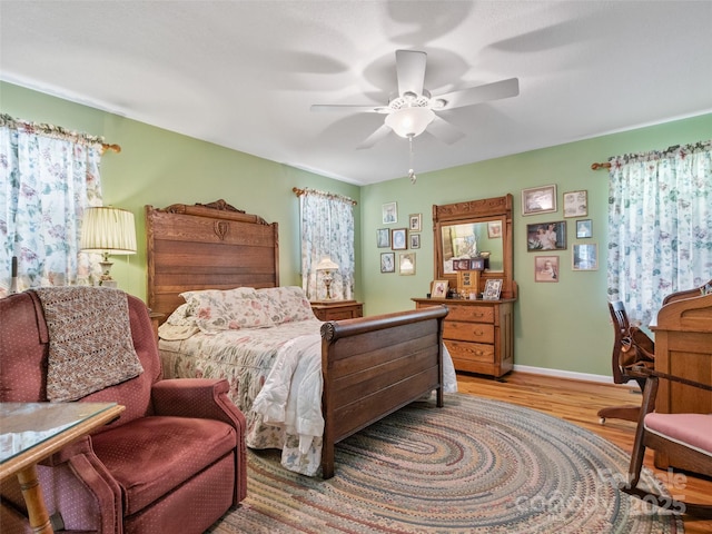 17 Gun Flint Dr, Burnsville, NC 28714 - bedroom featuring light wood-type flooring, a ceiling fan, and baseboards