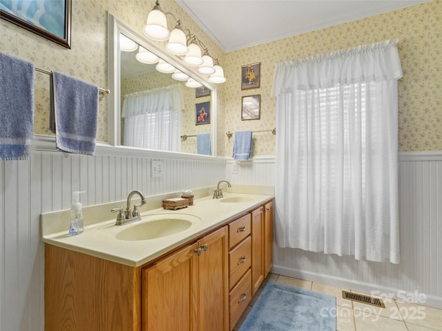 17 Gun Flint Dr, Burnsville, NC 28714 - bathroom featuring wallpapered walls, crown molding, wainscoting, double vanity, and tile patterned floors