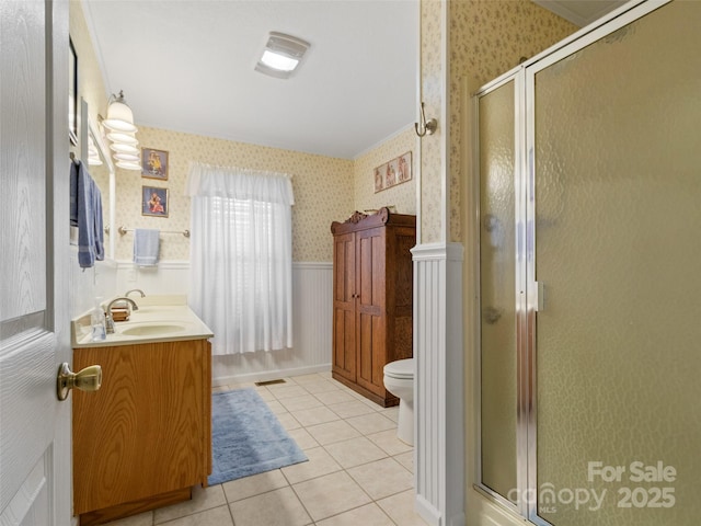 17 Gun Flint Dr, Burnsville, NC 28714 - bathroom featuring wallpapered walls, vanity, a stall shower, toilet, and wainscoting