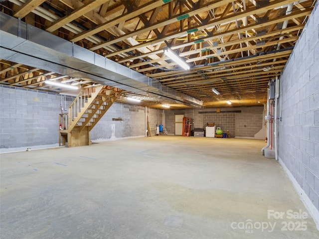 17 Gun Flint Dr, Burnsville, NC 28714 - basement featuring stairs and concrete block wall