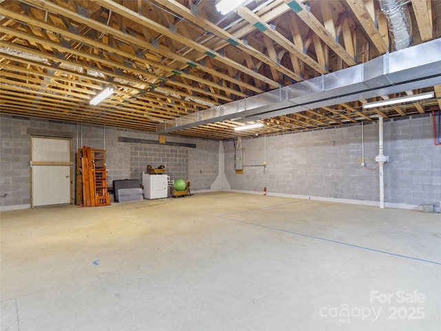 17 Gun Flint Dr, Burnsville, NC 28714 - garage with electric panel, washer / dryer, and concrete block wall