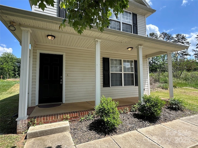 entrance to property featuring covered porch