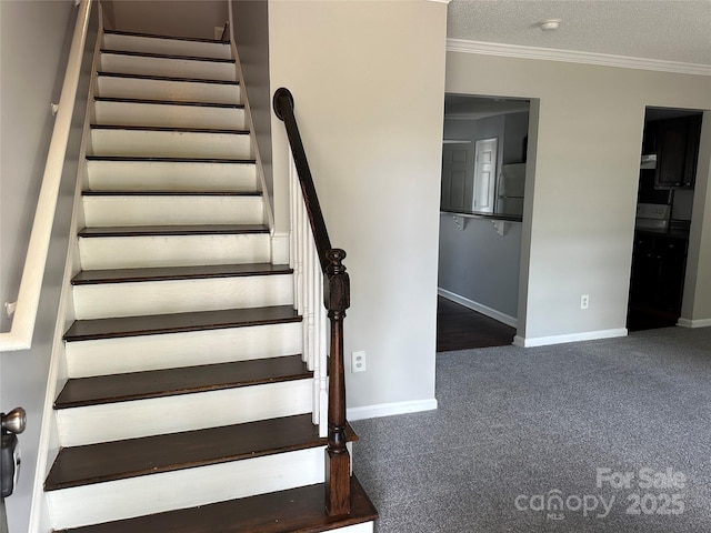 stairway featuring ornamental molding, baseboards, and carpet floors