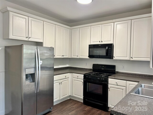 9907 Furlong Trl, Charlotte, NC 28269 - kitchen with black appliances, dark wood-type flooring, a sink, and white cabinetry