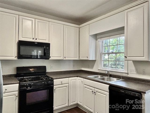 9907 Furlong Trl, Charlotte, NC 28269 - kitchen with black appliances, a sink, dark countertops, and white cabinets