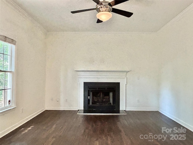 9907 Furlong Trl, Charlotte, NC 28269 - unfurnished living room with wood finished floors, baseboards, ceiling fan, a fireplace, and ornamental molding