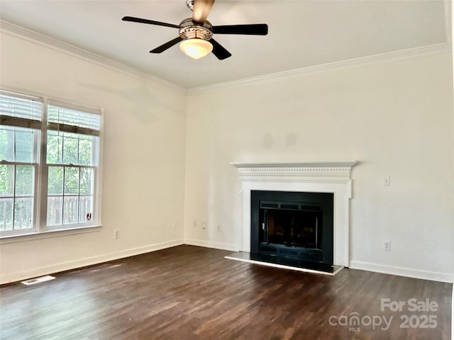 9907 Furlong Trl, Charlotte, NC 28269 - unfurnished living room with dark wood-style floors, ornamental molding, baseboards, ceiling fan, and a fireplace with raised hearth
