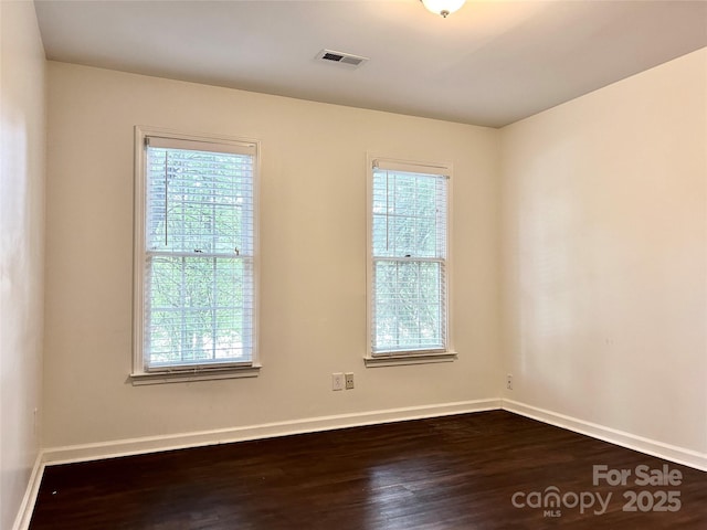 9907 Furlong Trl, Charlotte, NC 28269 - unfurnished room with dark wood-type flooring and baseboards