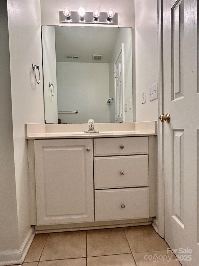 9907 Furlong Trl, Charlotte, NC 28269 - bathroom featuring tile patterned flooring, vanity, and baseboards