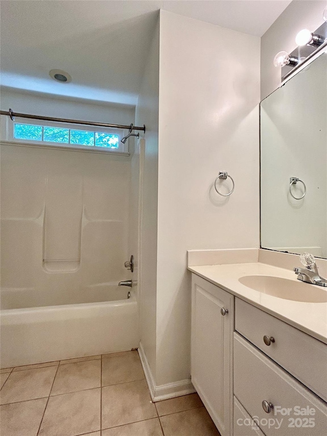 9907 Furlong Trl, Charlotte, NC 28269 - bathroom with tile patterned floors, vanity, tub / shower combination, and baseboards