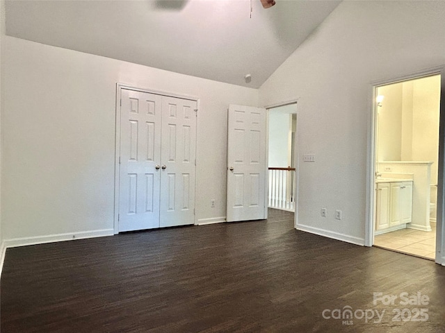 9907 Furlong Trl, Charlotte, NC 28269 - unfurnished bedroom with wood finished floors, lofted ceiling, baseboards, a closet, and connected bathroom