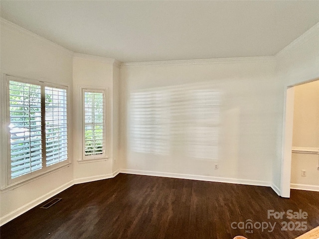 9907 Furlong Trl, Charlotte, NC 28269 - empty room with dark wood finished floors, baseboards, and crown molding