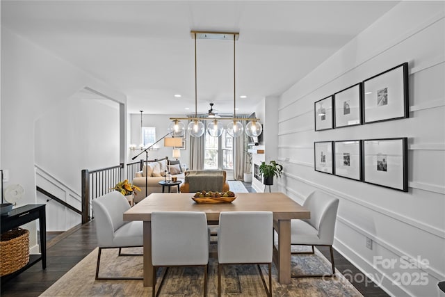 dining space with a chandelier, wood finished floors, and recessed lighting