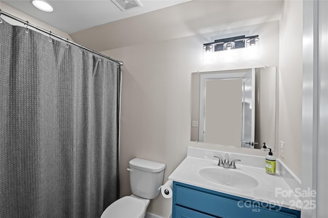full bathroom featuring vanity and toilet