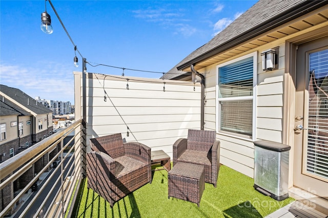 view of patio featuring a balcony