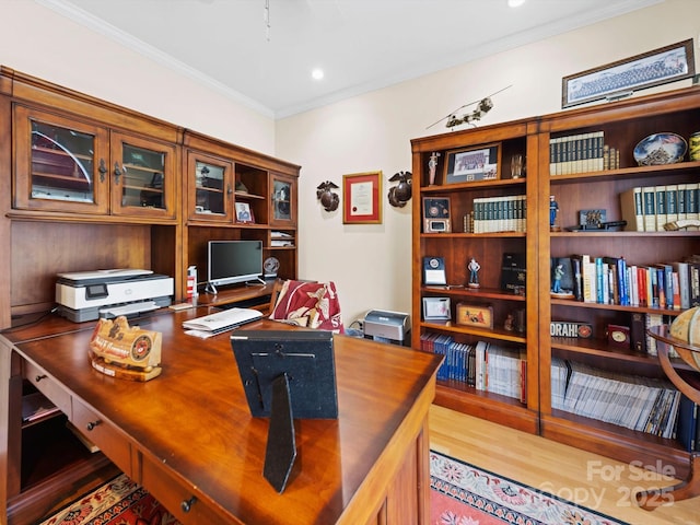 office featuring ornamental molding and wood finished floors