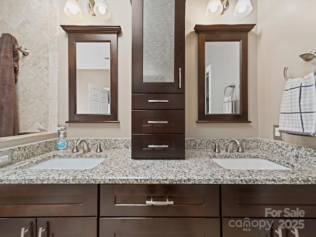 bathroom with double vanity and a sink