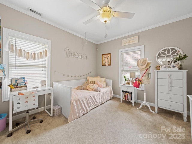 bedroom with crown molding, carpet, ceiling fan, and visible vents