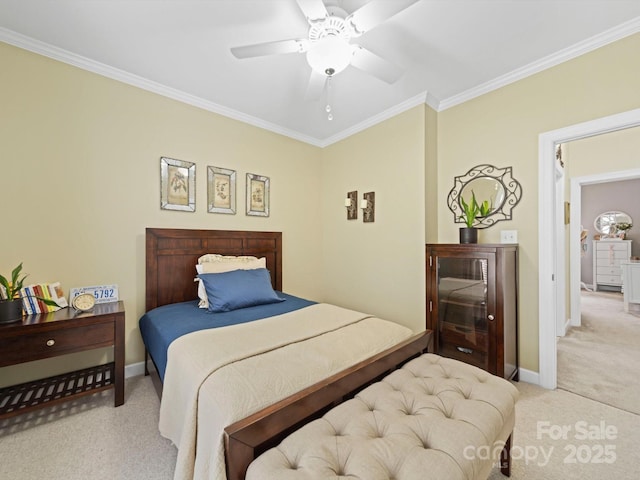 carpeted bedroom featuring crown molding, baseboards, and ceiling fan