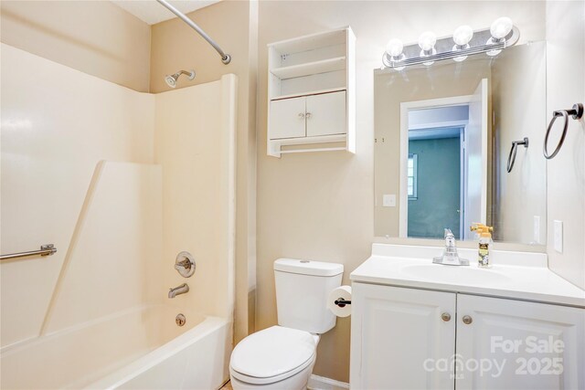 bathroom featuring bathing tub / shower combination, toilet, and vanity