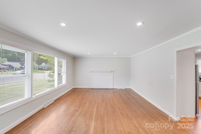 2001 Tyvola Rd, Charlotte, NC 28210 - unfurnished living room with light wood-style flooring, crown molding, recessed lighting, and baseboards